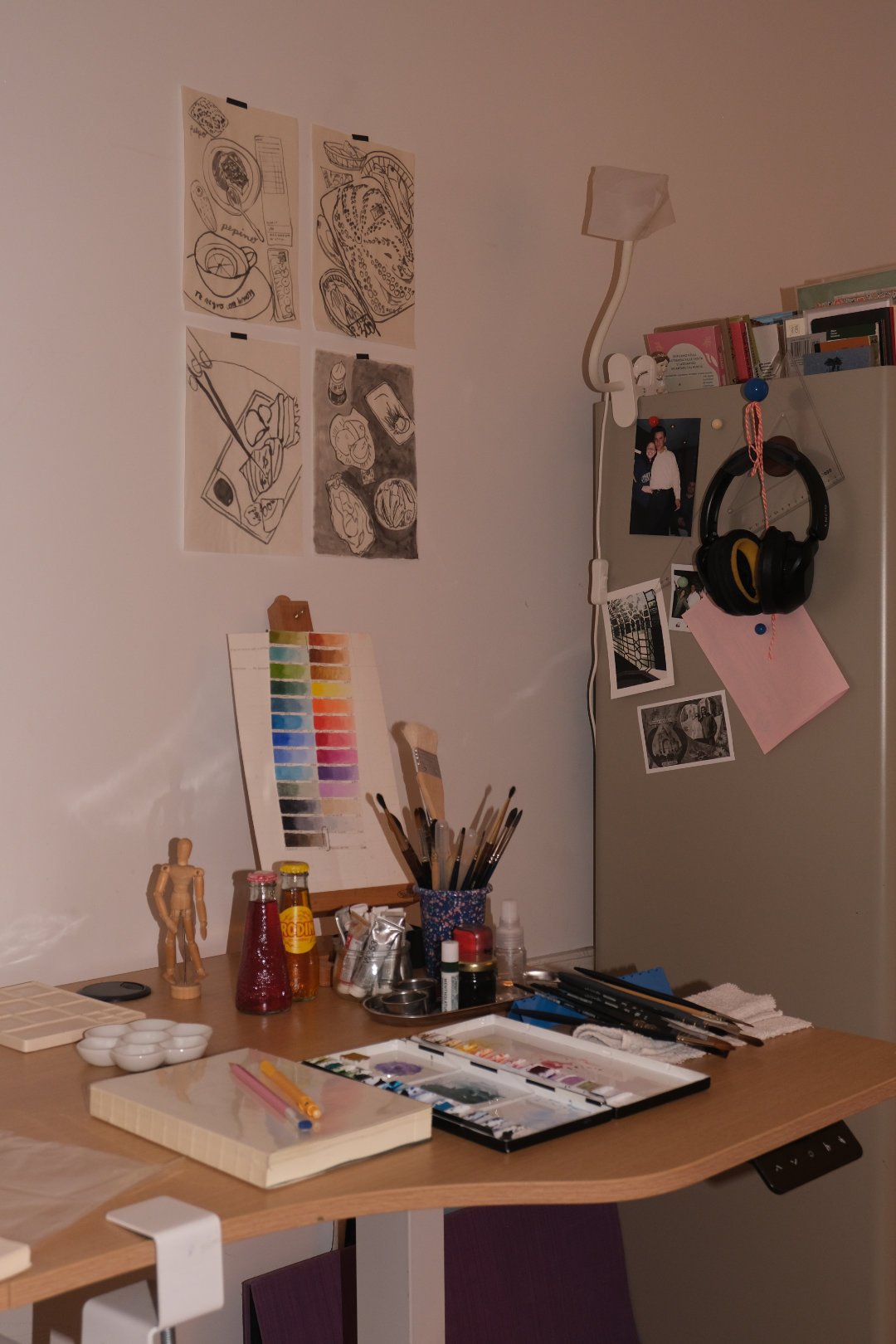 Photo of a person drawing in a sketchbook